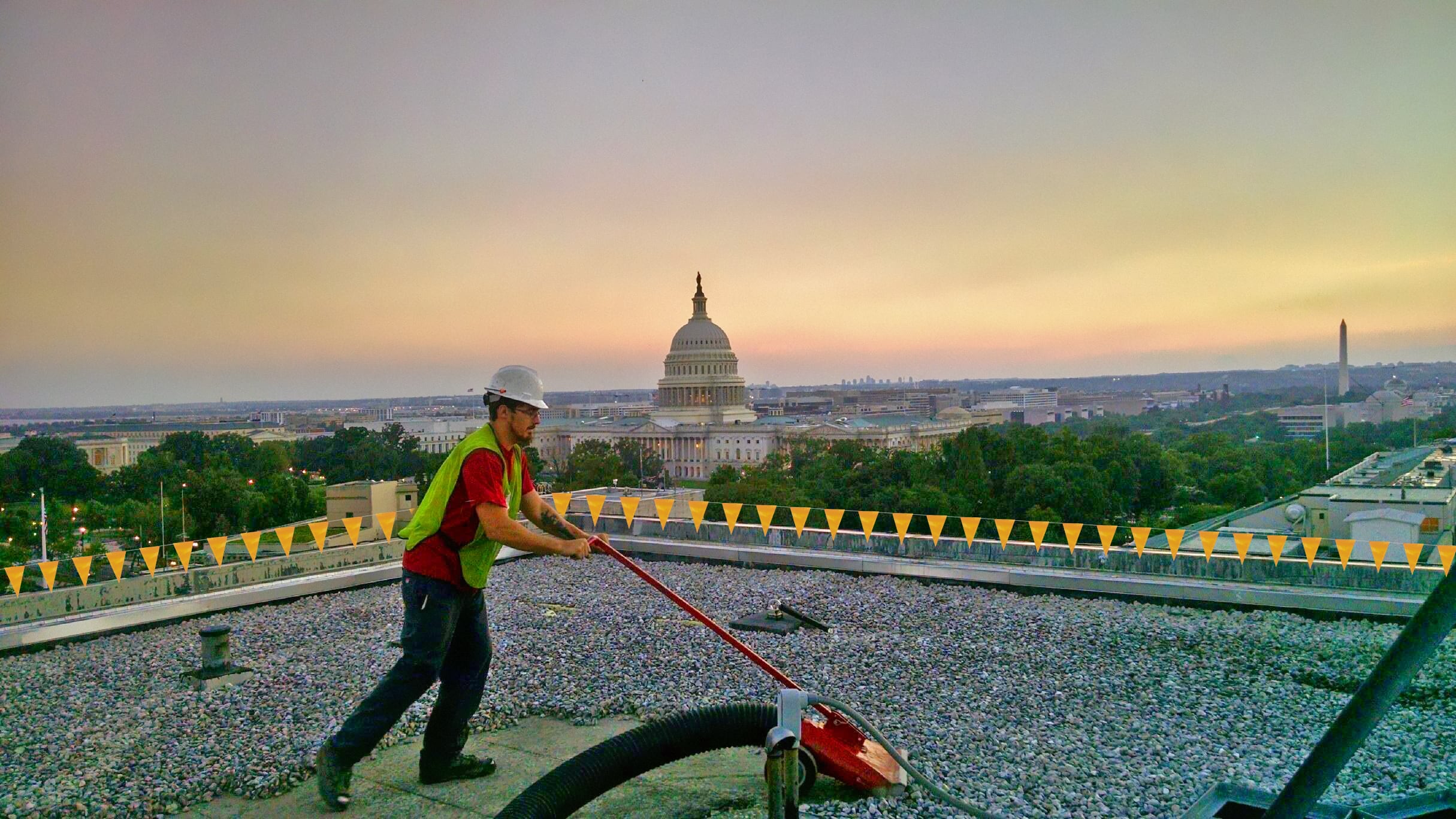 Worker Vacuuming Roof of Senate Hart Building Washington, D.C.